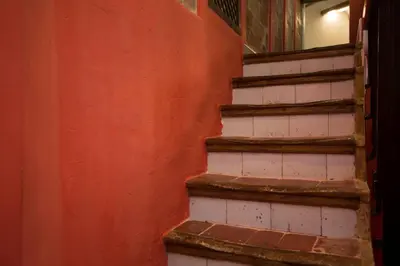 a set of stairs in an orange wall at Next to Central Market, Cathedral and Town Hall in Valencia