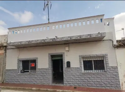 a white building with windows and a door at ROSA in Llaurí