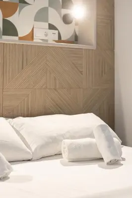 a bedroom with two towels on a bed at Victoria Inn Apartment in Valencia