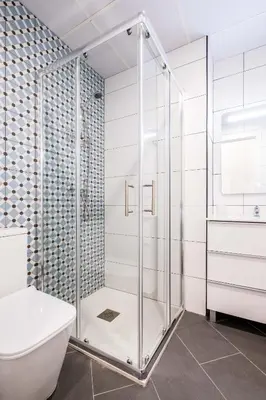 a shower in a bathroom with a toilet and a sink at New and Modern Apartment with Comfy Beds in Valencia