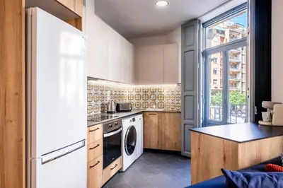 a kitchen with a washer and dryer at Beautiful Suite with Private Terrace in Valencia