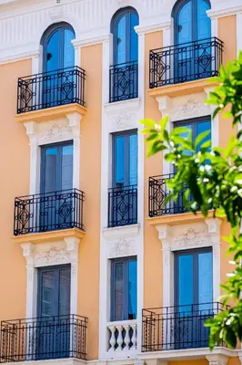 a facade of a building with windows and balconies at Classy Studio Apartment with Unique Design in Valencia