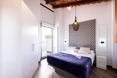 a bedroom with a purple bed in a room at Spacious Penthouse with Massive Terrace in Valencia
