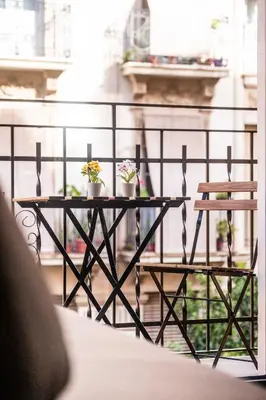 a table with two plants on top of a balcony at Serene Apartment with a Relaxing Atmosphere in Valencia