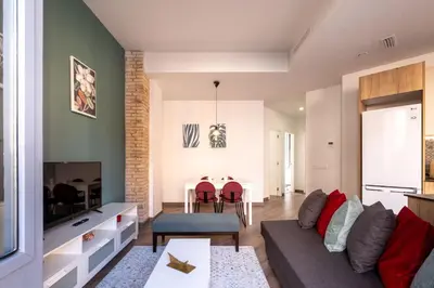 a living room with a couch and a table at Serene Apartment with a Relaxing Atmosphere in Valencia