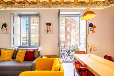 a living room with a couch and a table at Amazing Apartment with aFun and Friendly Atmosphere in Valencia