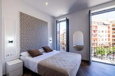 a bedroom with a bed and a large window at Spacious Apartment with Great Views in Valencia