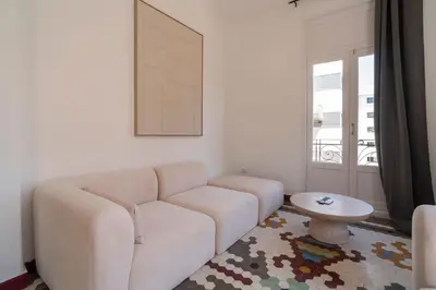 a living room with a couch and a table at VLC Host - Cubells Apartments in Valencia