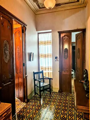 a room with a chair in the middle of a room at LA TRAVIATA - Buñol in Buñol