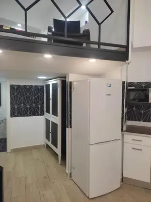 a room with two refrigerators and a loft at Loft puerto de Valencia in Valencia