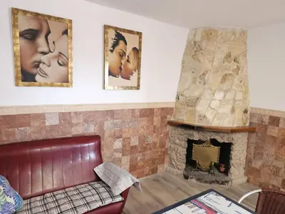 a living room with a couch and a fireplace at EL ARA DE LOS ORISHAS in Siete Aguas