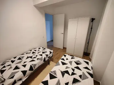 a bedroom with two beds with black and white at Near Beach Cullera in Cullera