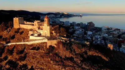 an aerial view of a castle on a mountain at Near Beach Cullera in Cullera