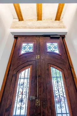 a wooden door with two windows on top of it at Quality Apartment with Homely Decor in Valencia