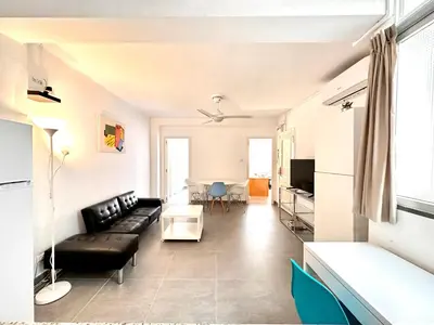 a living room with a couch and a table at Malvarrosa Beach in Valencia
