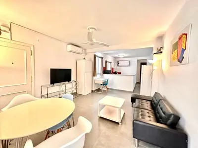 a living room with a couch and a table at Malvarrosa Beach in Valencia