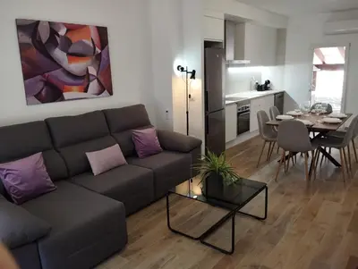 a living room with a couch and a table at CAN’SELMA 2 in Chella