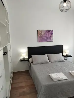 a bedroom with a bed with two towels on it at CAN’SELMA 2 in Chella