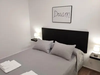 a bedroom with a bed with two pillows on it at CAN’SELMA 2 in Chella