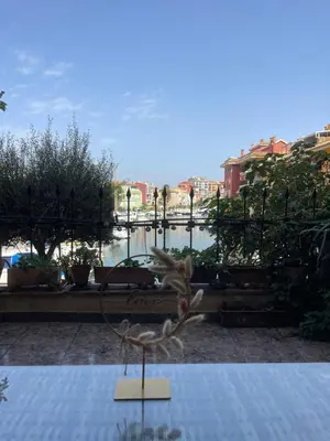 a sculpture of a bird on a table in a garden at comfortable apartment in an elite area with a beautiful veranda in Port Saplaya