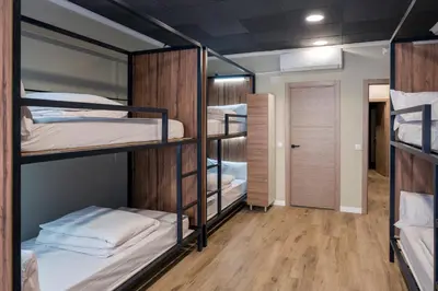 a dorm room with bunk beds and a hallway at SOM Hostel Valencia in Valencia