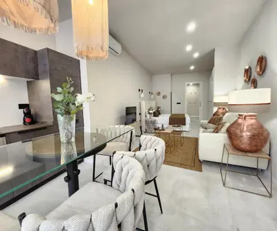 a dining room and living room with a table and chairs at MD Pare Presentat 1 in Valencia