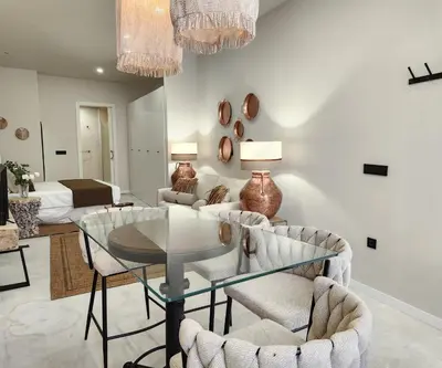 a living room with a glass table and chairs at MD Pare Presentat 1 in Valencia