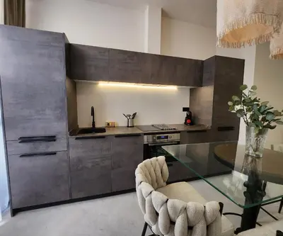 a kitchen with a glass table and a counter at MD Pare Presentat 1 in Valencia