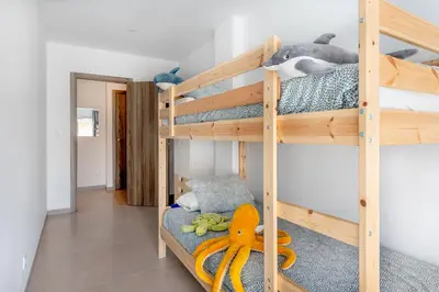 a bunk bed room with two bunk beds at Vilamercat in Sueca