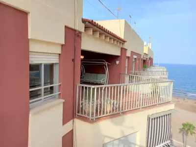 a building with a balcony overlooking the beach at El Raco, C-9-17 in Cullera