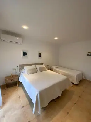 a bedroom with a large white bed in a room at Casa Rural Roa in Casinos