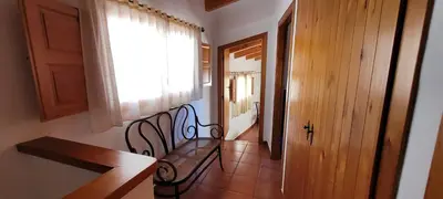 a hallway with a bench next to a window at Candela de la Murtera in Chelva