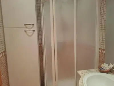 a bathroom with a shower and a sink at Cullera apartamento junto al mar in Cullera