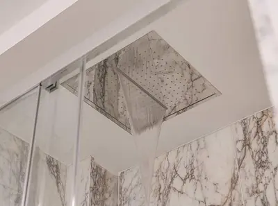 a shower with a shower curtain in a bathroom at Luxury loft on the beach in Valencia