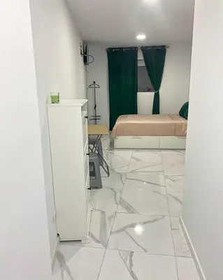 a bedroom with a bed and a tiled floor at Your Perfectt place in Valencia