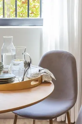 a chair with a table with a bowl on top of it at VLC HOST - Reino in Valencia