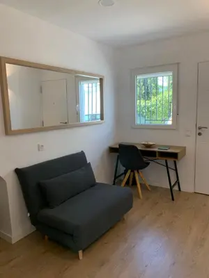 a living room with a couch and a table at DeCASTA in Chulilla
