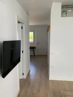 a living room with a flat screen tv on a wall at DeCASTA in Chulilla