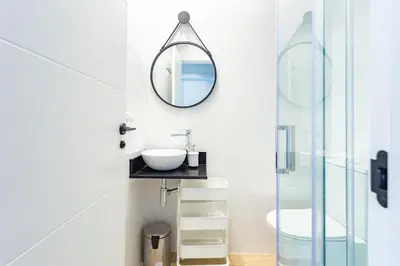 a bathroom with a sink and a mirror at Private room Beach Valencia in Valencia