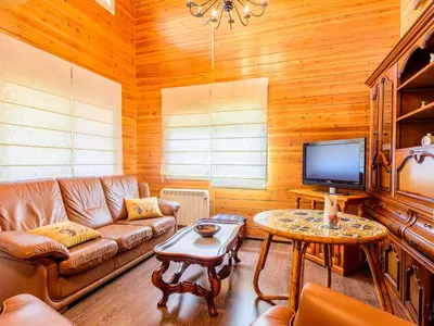 a living room with a couch and a tv at Holiday Home La Alqueria de Jordi by Interhome in El Grao