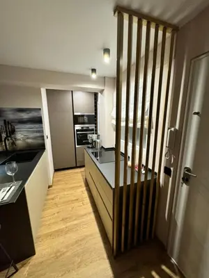 a kitchen with a counter top and a kitchen sidx sidx sidx sidx at Luxury apartment Y after renovation in Cullera with parking in Cullera