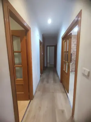 an empty hallway with two doors and a hallwayngth at Planta baja, bien comunicada, cerca de la playa. in Valencia