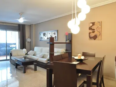 a living room with a couch and a table at Acogedor apartamento en Burriana centro in Burriana