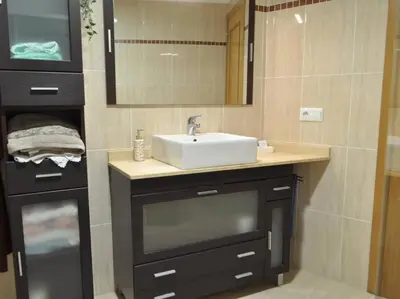 a bathroom with a sink and a mirror at Acogedor apartamento en Burriana centro in Burriana