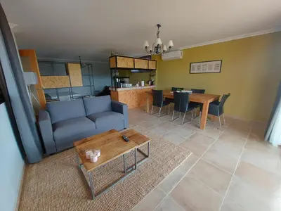 a living room with a couch and a table at Posada la Toscana in Montroy