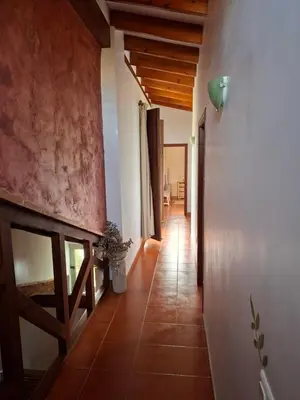 a hallway of a house with a tile floor at CortijoRamon in El Brosquil