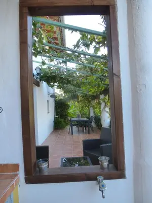 a view of a patio through a window at CortijoRamon in El Brosquil