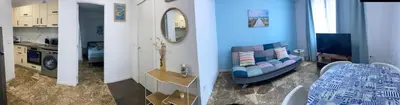 a living room with a sink and a bathroom at Del Mar one bed flat in Puerto de Sagunto