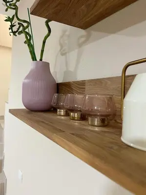 a purple vase sitting on a shelf with three glass bowls at Modern apartment in Valencia, Port Saplaya, by the sea in Port Saplaya