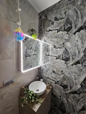a bathroom with a sink and a pendant light at Lounge garden sea relax in Valencia